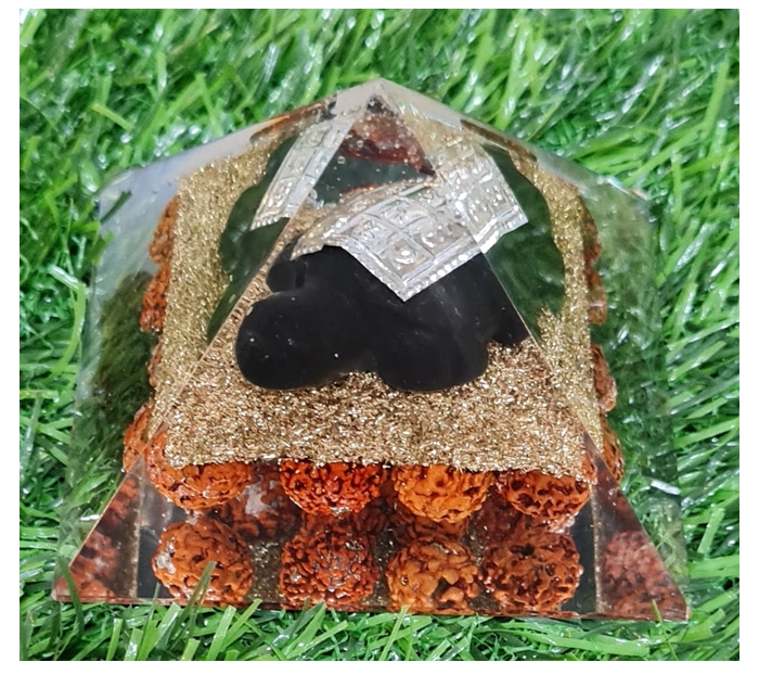 Rudraksha with Turtle Orgone Pyramid is a harmonious blend of sacred Rudraksha beads and the mystical Orgone Pyramid with a turtle motif.